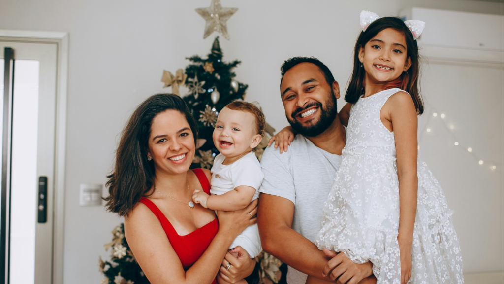 family underneath christmas tree